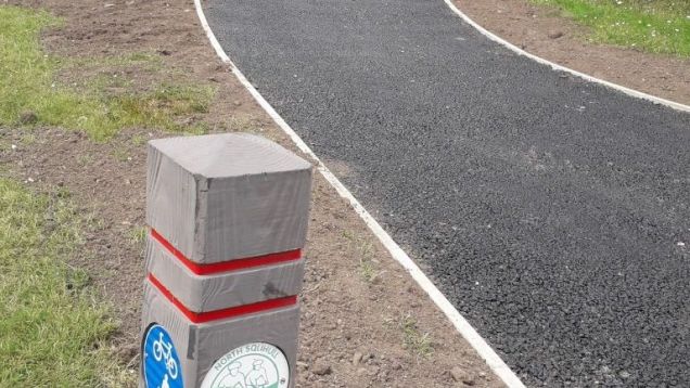 Cycleway post by under-construction path, July 2019